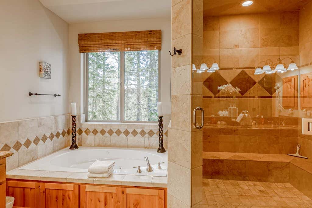 Inviting spacious home with fireplace, deck, hot tub, full kitchen, & W&D