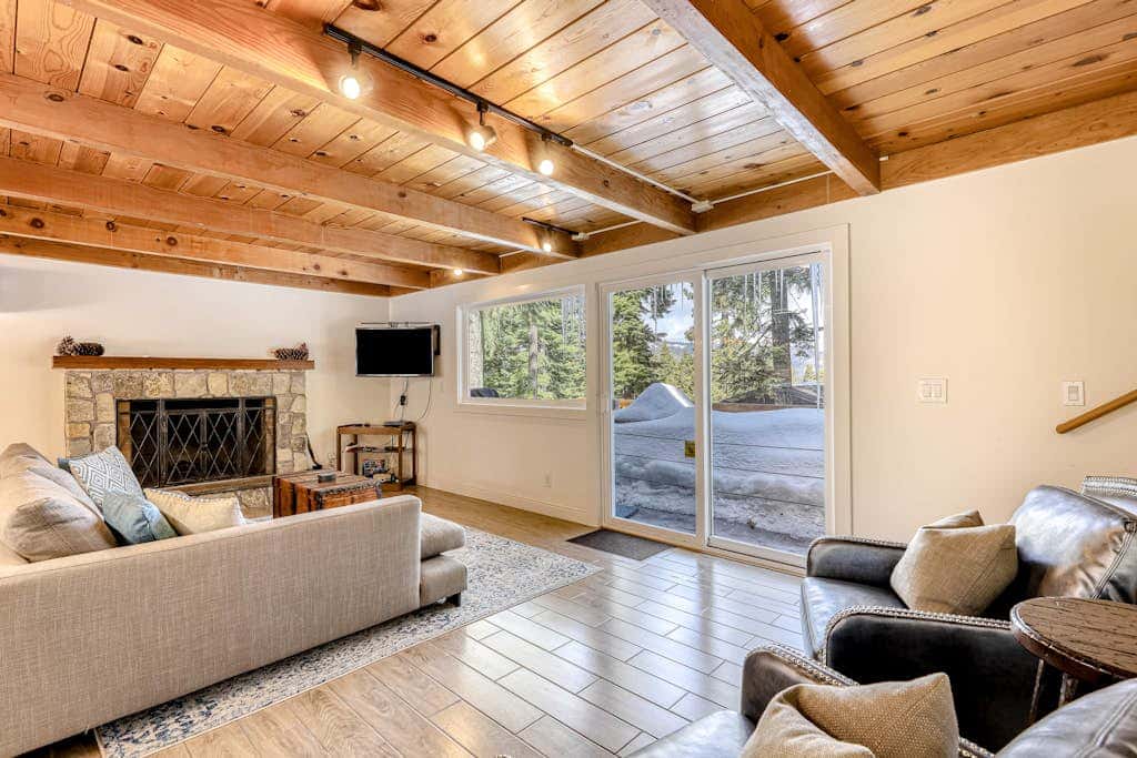 Classic Tahoe cabin charm with partial lake views, Chamberlands amenities, and year-round adventure just minutes away.