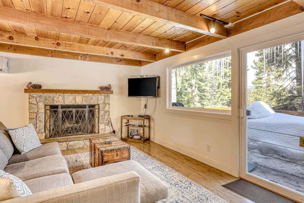 Classic Tahoe cabin charm with partial lake views, Chamberlands amenities, and year-round adventure just minutes away.