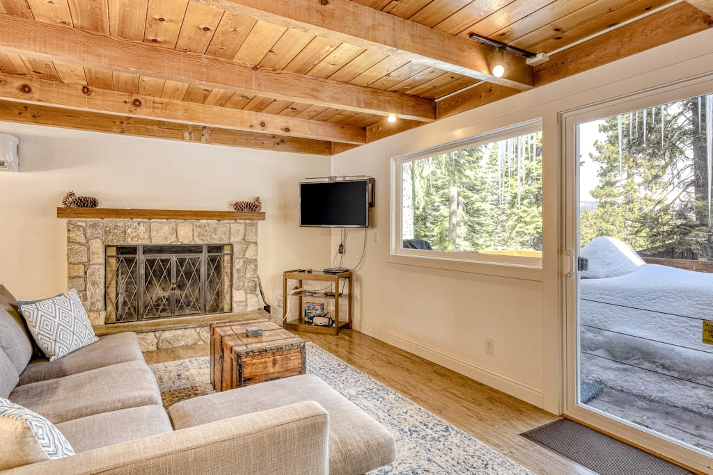 Classic Tahoe cabin charm with partial lake views, Chamberlands amenities, and year-round adventure just minutes away.