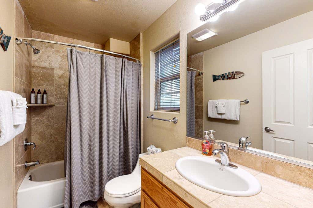 Cozy, enchanting retreat with hot tub, stunning deck, & balcony - close to beach