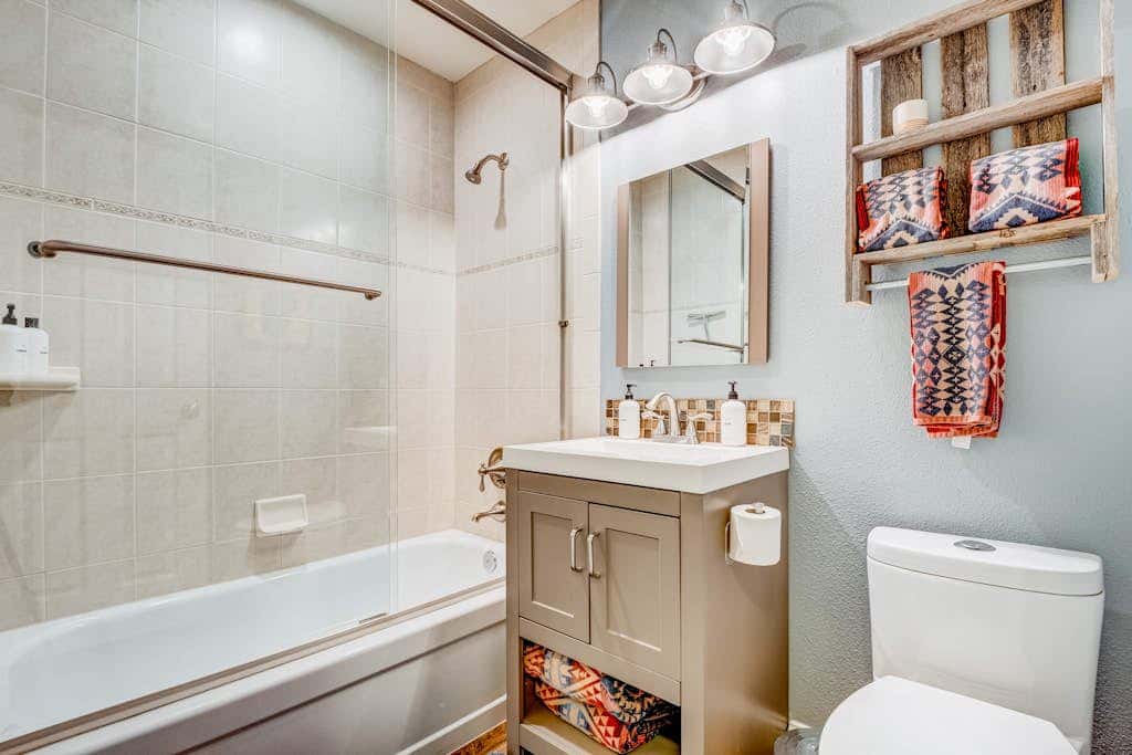 Two-story mountain-view condo with balcony, fireplace & pool - dog-friendly