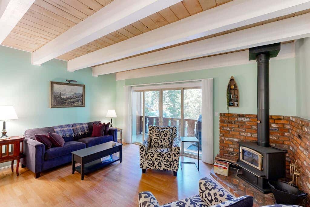 Forest-view condo with wood fireplace & walkable locale - dog-friendly