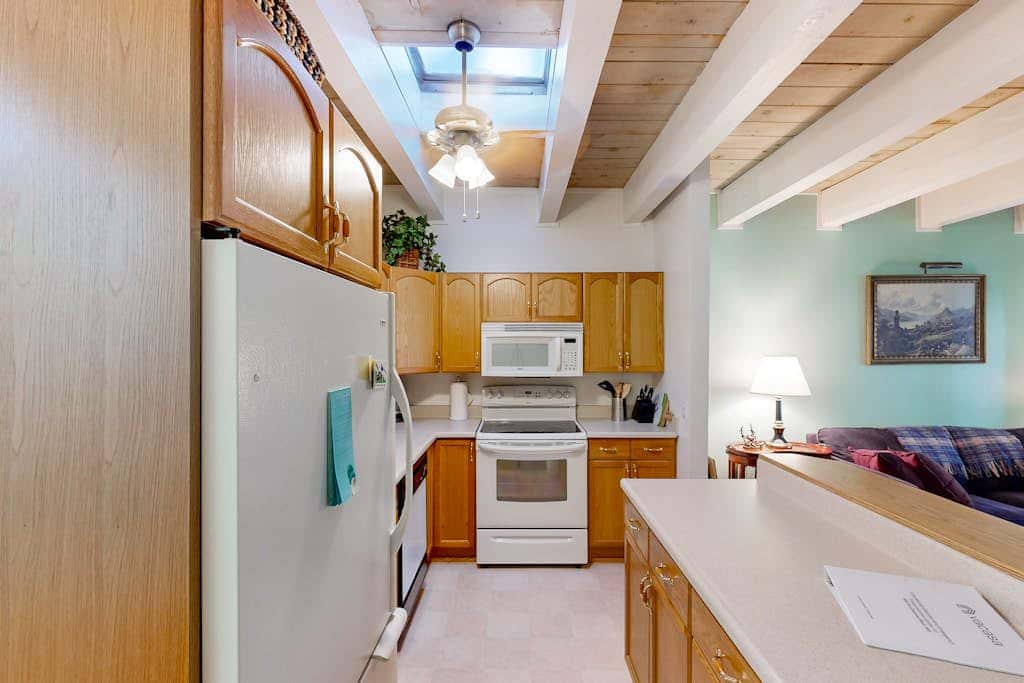 Forest-view condo with wood fireplace & walkable locale - dog-friendly