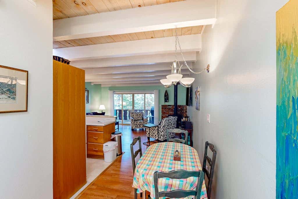 Forest-view condo with wood fireplace & walkable locale - dog-friendly