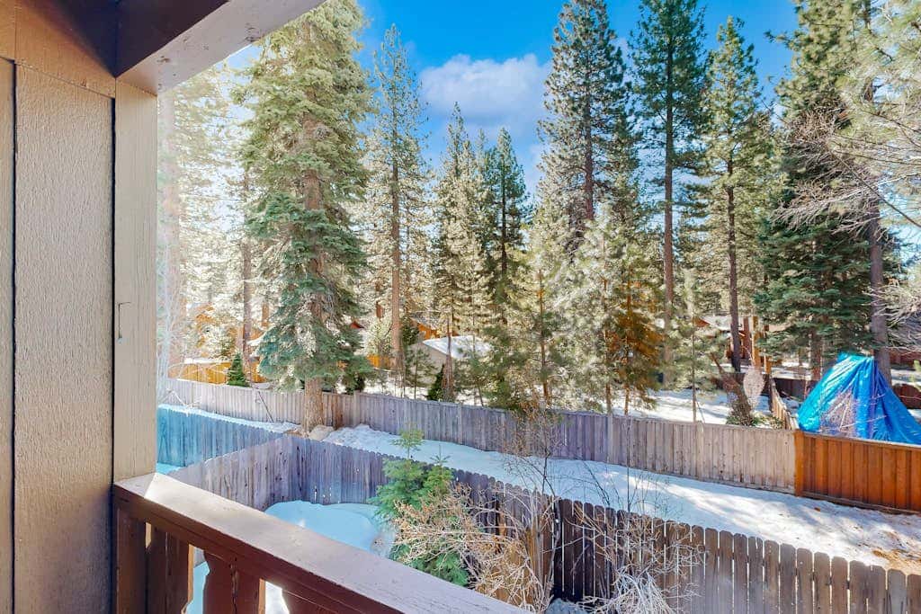 Forest-view condo with wood fireplace & walkable locale - dog-friendly