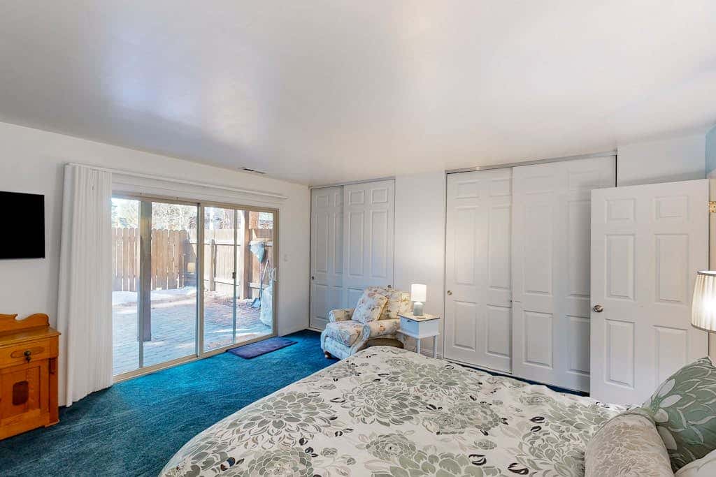 Forest-view condo with wood fireplace & walkable locale - dog-friendly