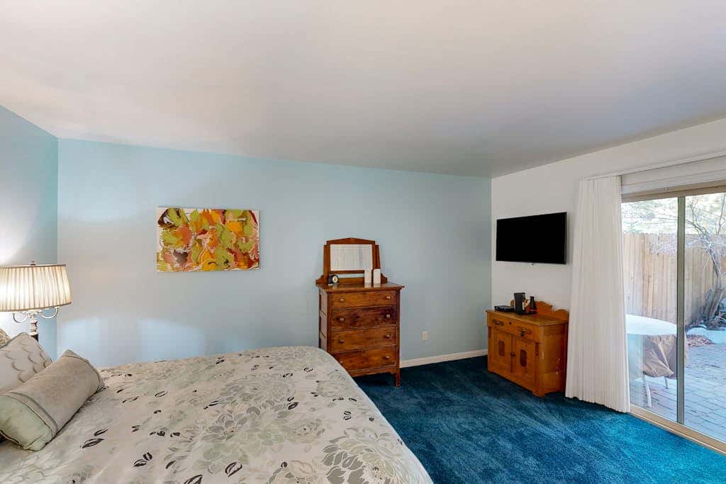 Forest-view condo with wood fireplace & walkable locale - dog-friendly