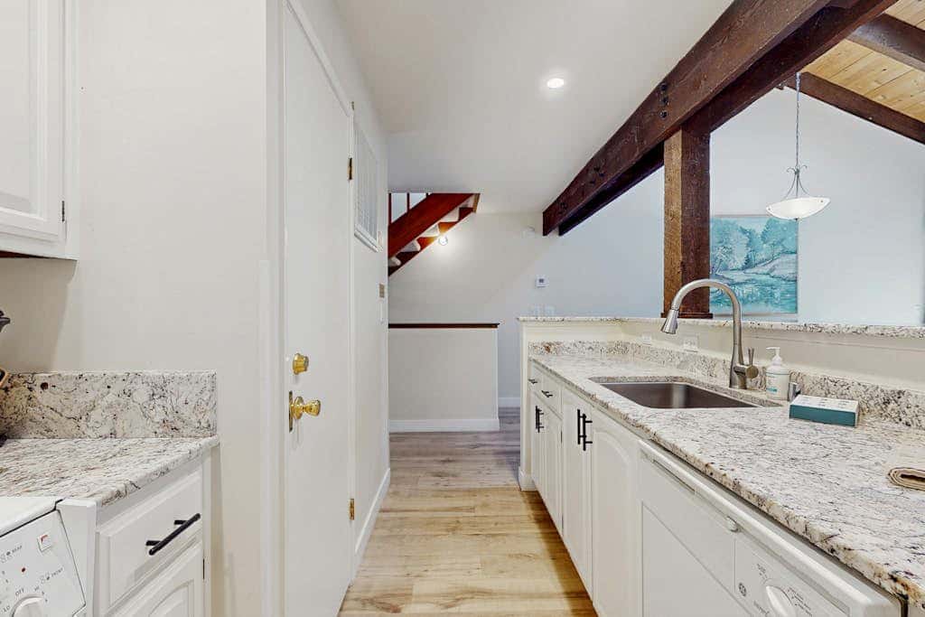 Let reality drift away with the lake view at this townhome with a private beach