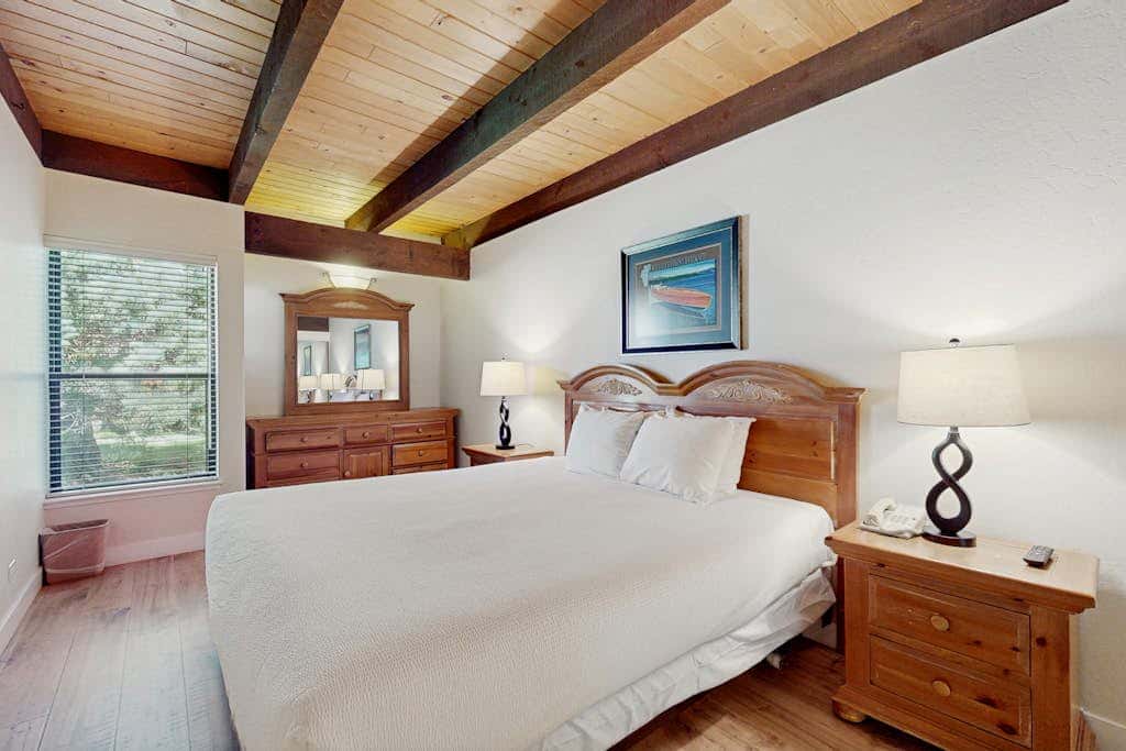 Let reality drift away with the lake view at this townhome with a private beach