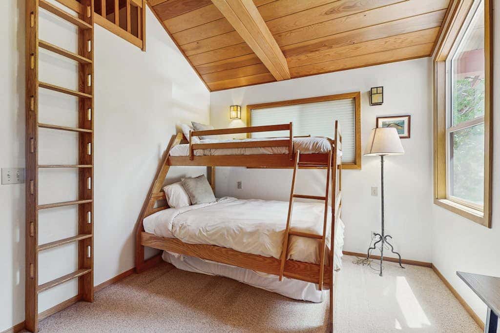 Terrific lakefront gem with private hot tub, dock & beach - near skiing & town
