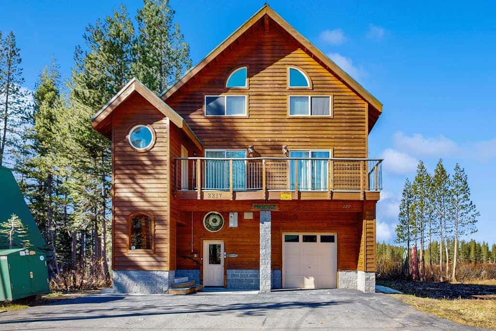 Family-friendly, lakefront getaway with a gas fireplace, furnished deck, & views