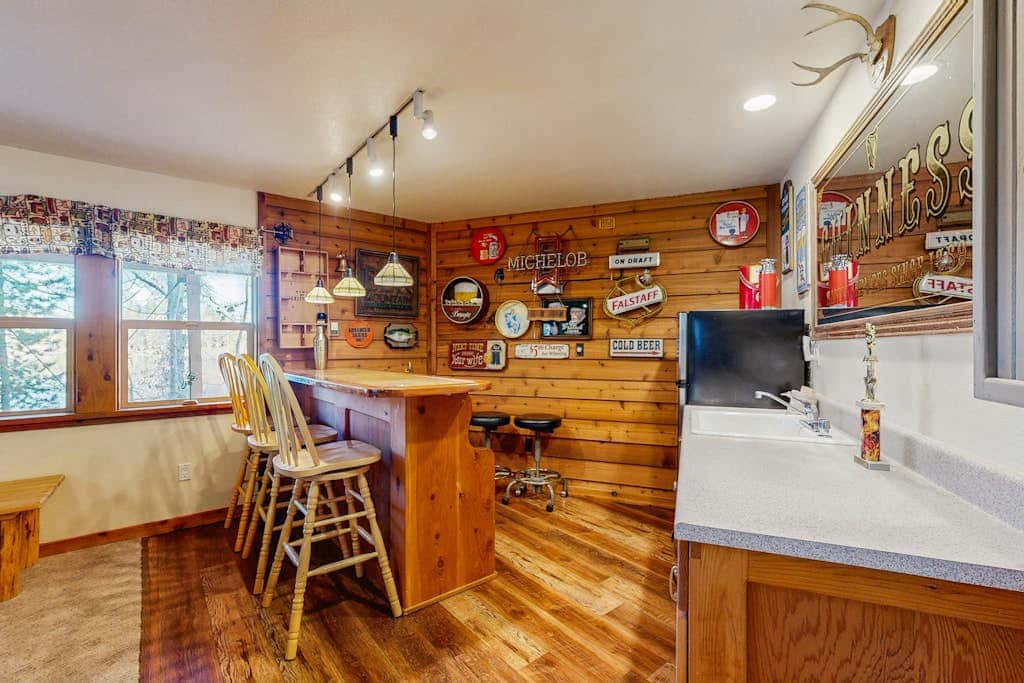 Family-friendly, lakefront getaway with a gas fireplace, furnished deck, & views