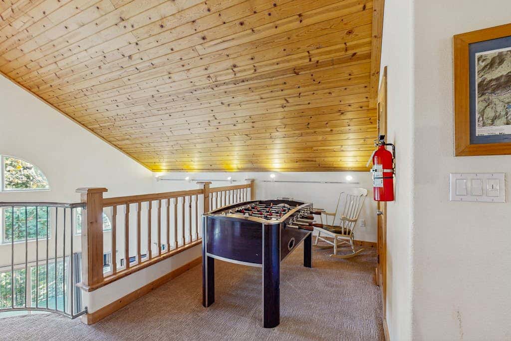 Family-friendly, lakefront getaway with a gas fireplace, furnished deck, & views