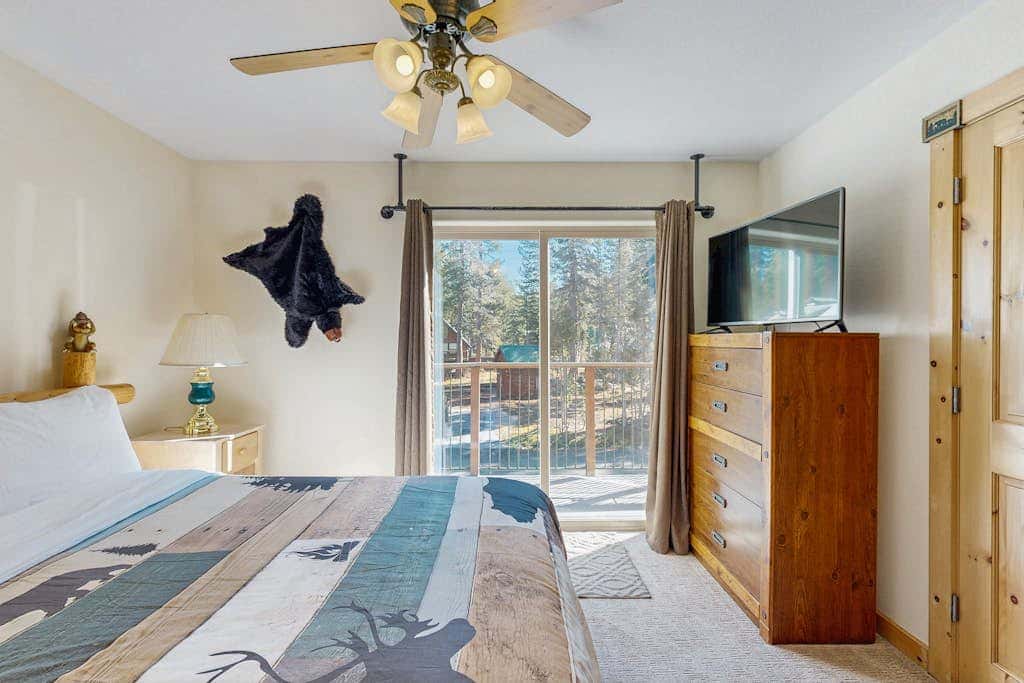 Family-friendly, lakefront getaway with a gas fireplace, furnished deck, & views