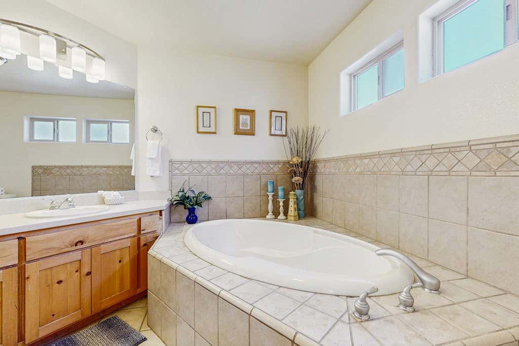 Family-friendly, lakefront getaway with a gas fireplace, furnished deck, & views