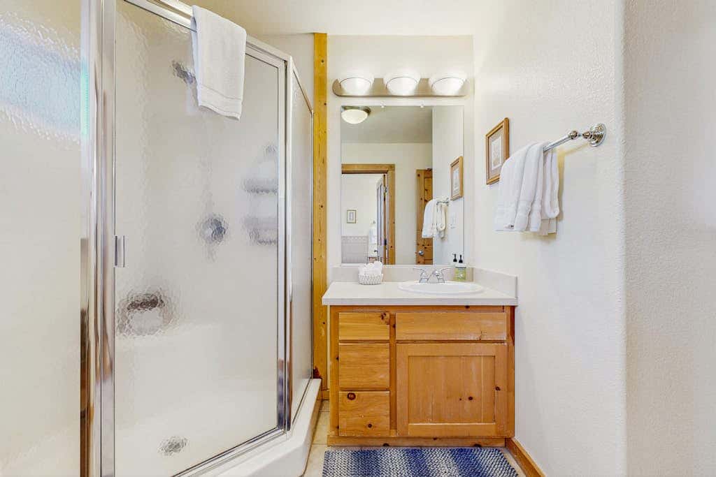 Family-friendly, lakefront getaway with a gas fireplace, furnished deck, & views