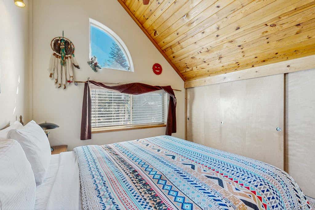 Family-friendly, lakefront getaway with a gas fireplace, furnished deck, & views