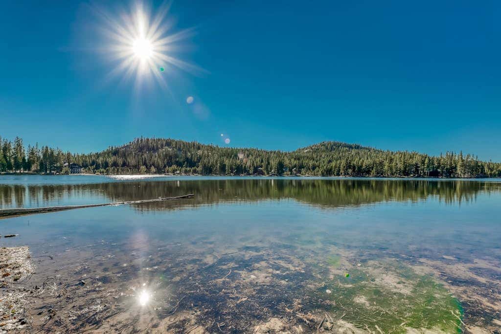 Family-friendly, lakefront getaway with a gas fireplace, furnished deck, & views