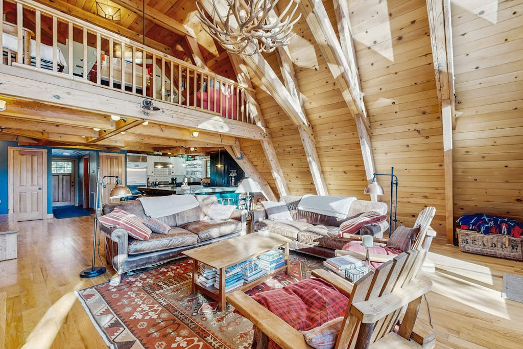 Luxury lakefront home with private hot tub, on-site dock, fireplace & HOA beach