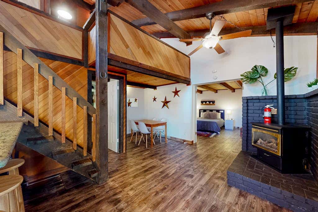 Dog-friendly nature escape with generous balcony, fireplace, & views, sleeps 6