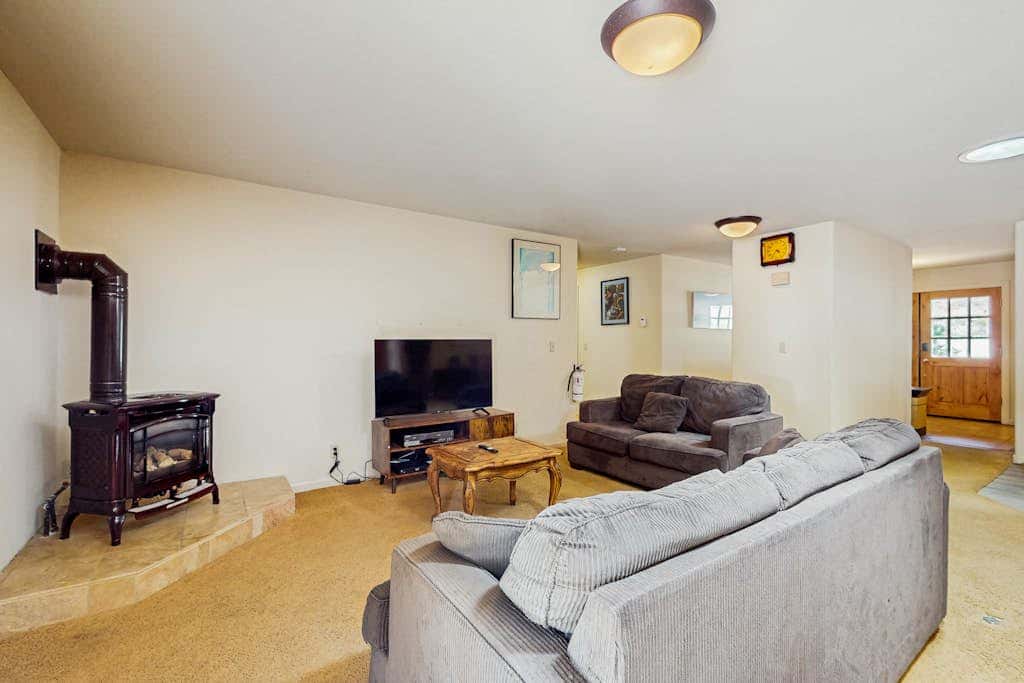 A spacious mountain retreat with a game room, forest views, and easy access to Heavenly and South Lake Tahoe.