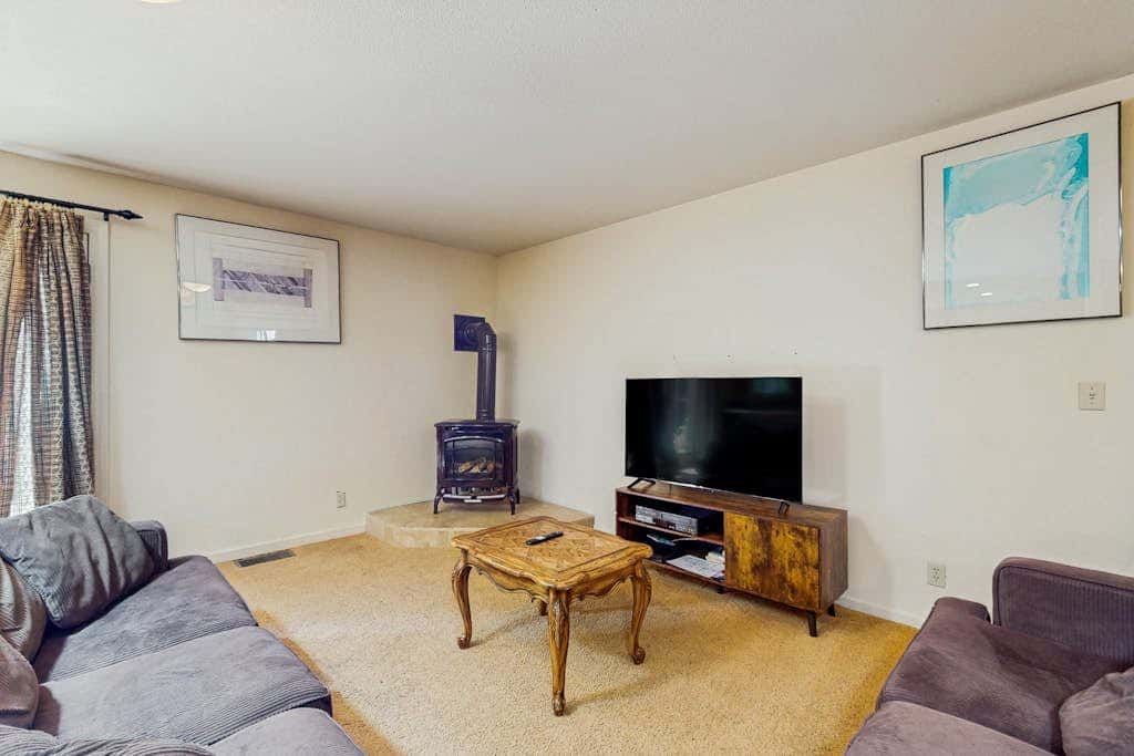 A spacious mountain retreat with a game room, forest views, and easy access to Heavenly and South Lake Tahoe.