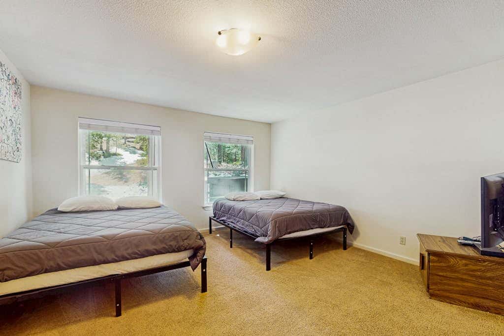 A spacious mountain retreat with a game room, forest views, and easy access to Heavenly and South Lake Tahoe.
