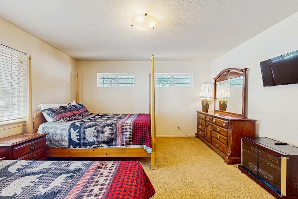 A spacious mountain retreat with a game room, forest views, and easy access to Heavenly and South Lake Tahoe.