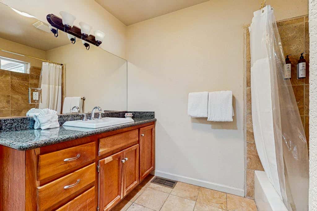 A spacious mountain retreat with a game room, forest views, and easy access to Heavenly and South Lake Tahoe.