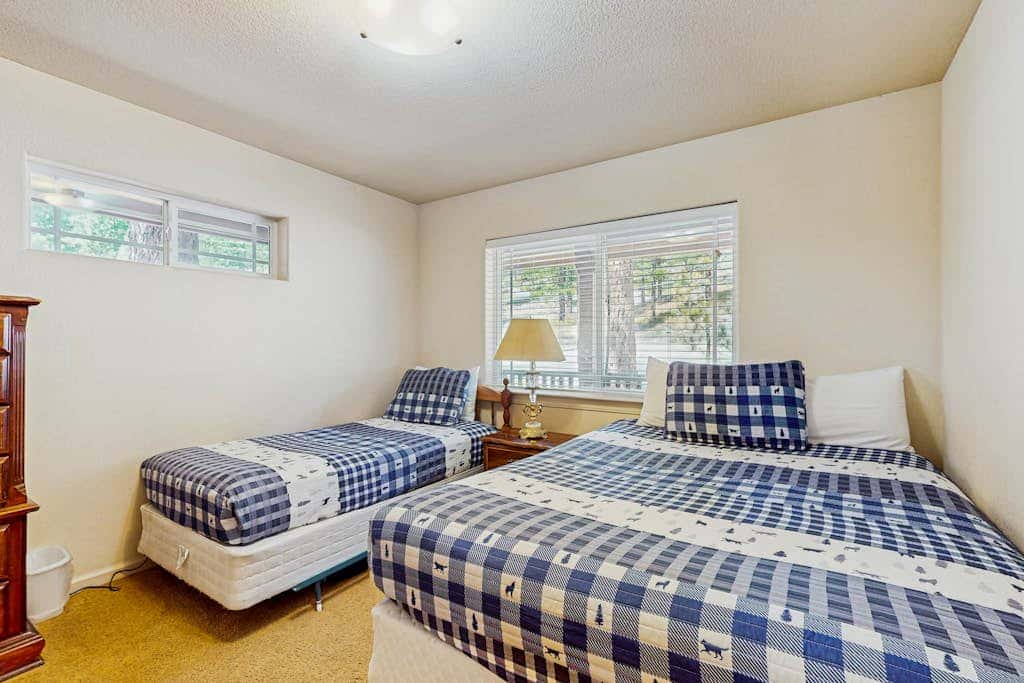 A spacious mountain retreat with a game room, forest views, and easy access to Heavenly and South Lake Tahoe.