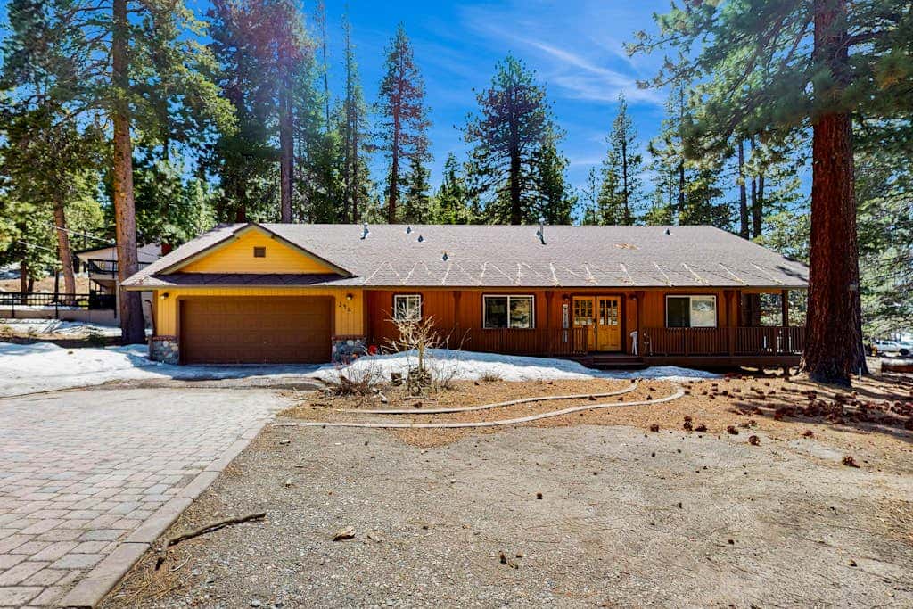 A spacious mountain retreat with a game room, forest views, and easy access to Heavenly and South Lake Tahoe.