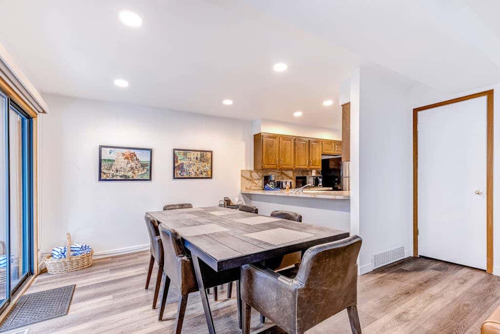 Central townhouse with private hot tub, wood fireplace, & ski shuttle access