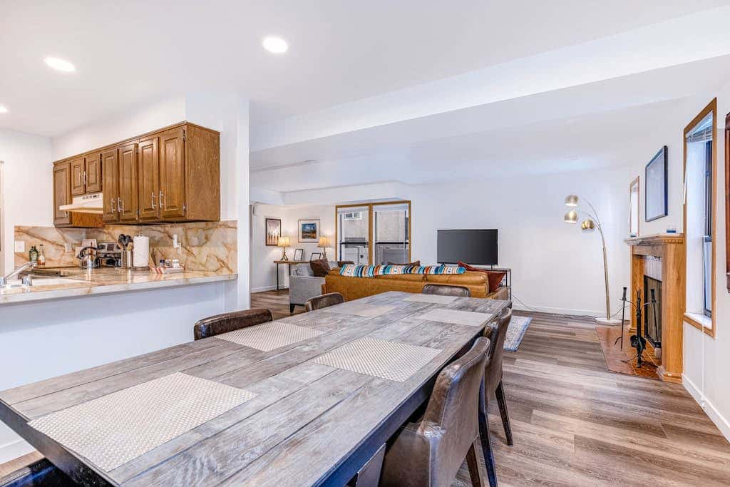 Central townhouse with private hot tub, wood fireplace, & ski shuttle access