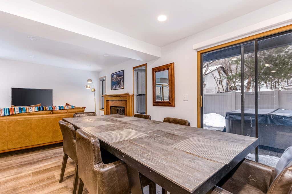 Central townhouse with private hot tub, wood fireplace, & ski shuttle access