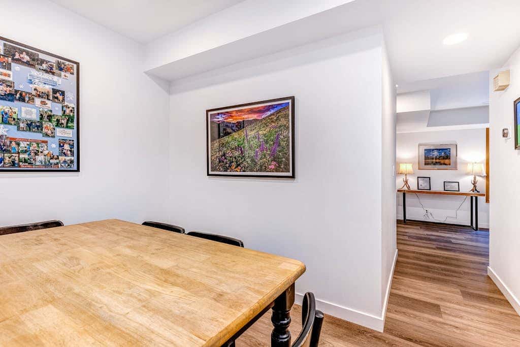 Central townhouse with private hot tub, wood fireplace, & ski shuttle access