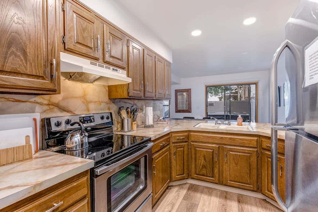 Central townhouse with private hot tub, wood fireplace, & ski shuttle access