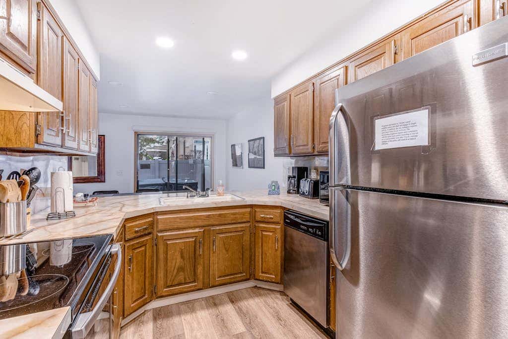 Central townhouse with private hot tub, wood fireplace, & ski shuttle access