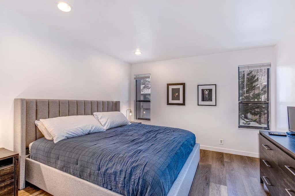 Central townhouse with private hot tub, wood fireplace, & ski shuttle access