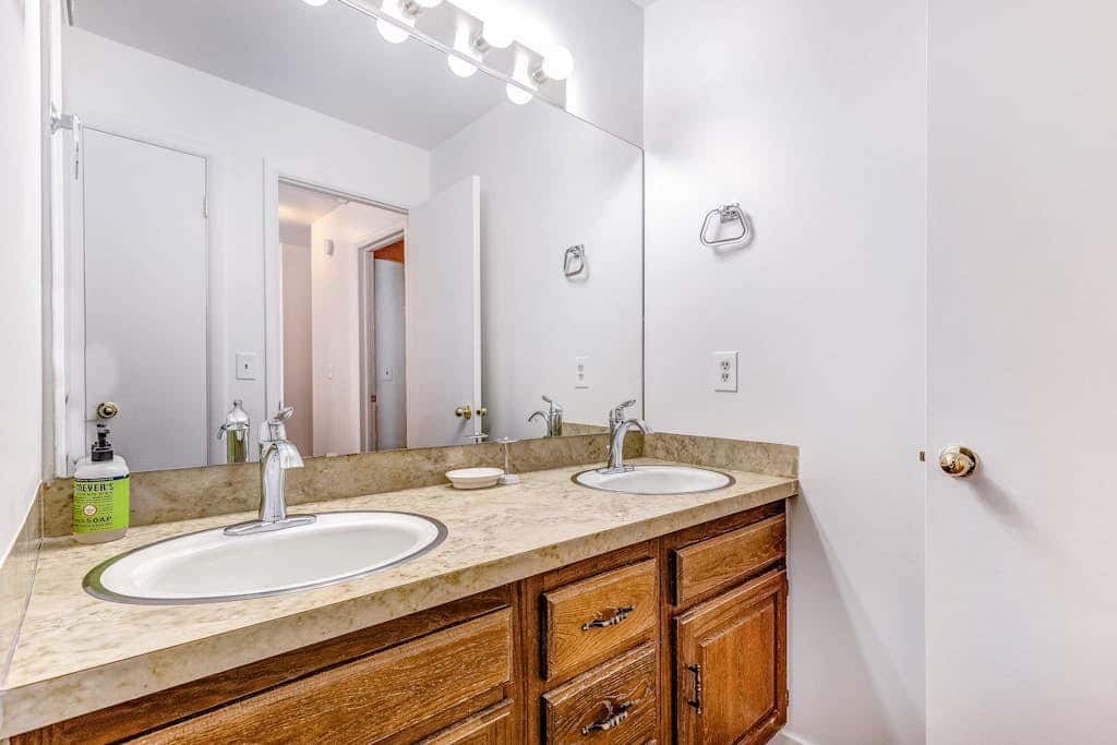 Central townhouse with private hot tub, wood fireplace, & ski shuttle access