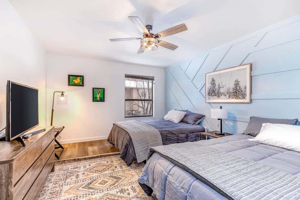 Central townhouse with private hot tub, wood fireplace, & ski shuttle access