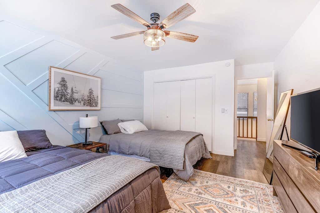 Central townhouse with private hot tub, wood fireplace, & ski shuttle access
