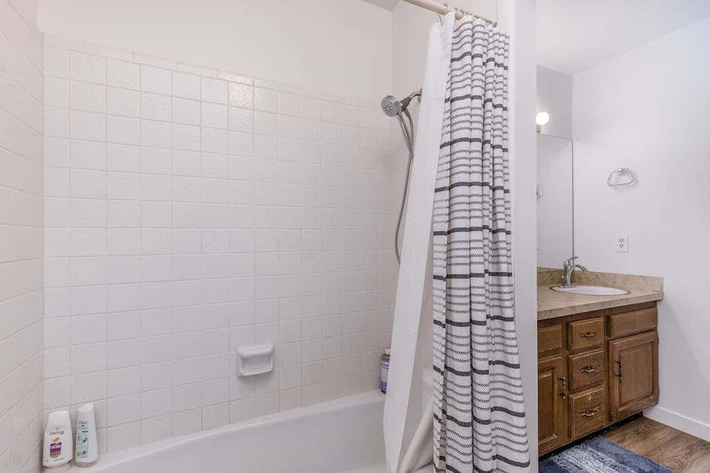 Central townhouse with private hot tub, wood fireplace, & ski shuttle access