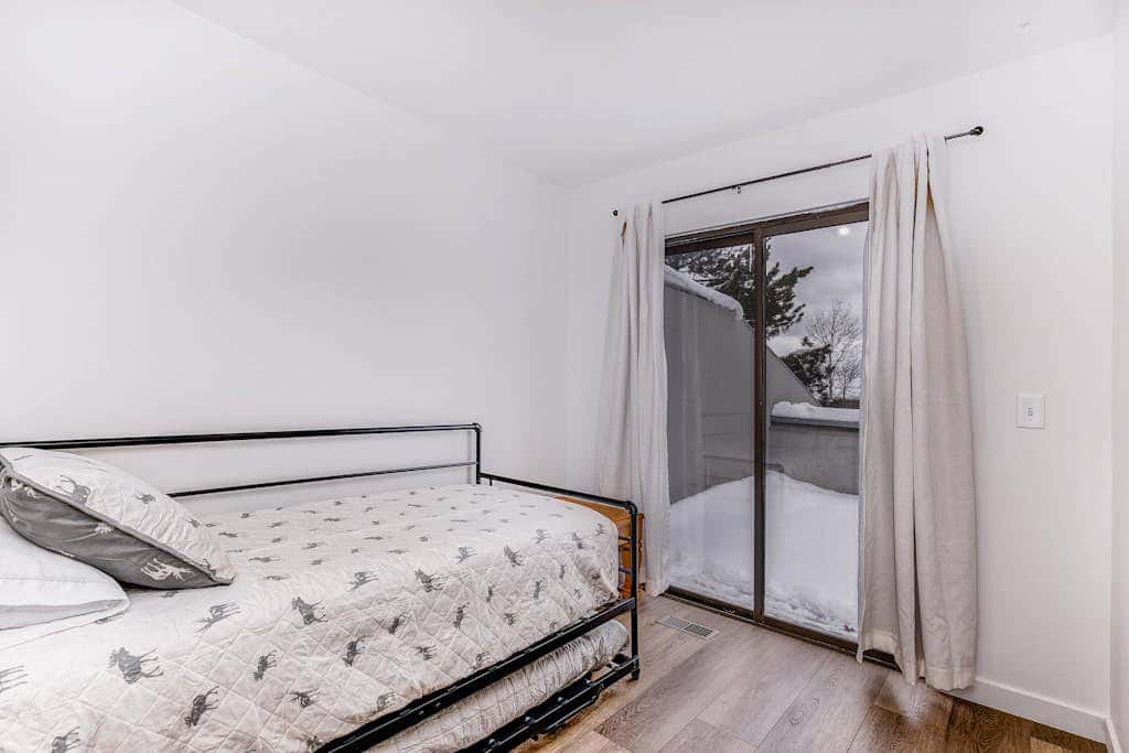Central townhouse with private hot tub, wood fireplace, & ski shuttle access