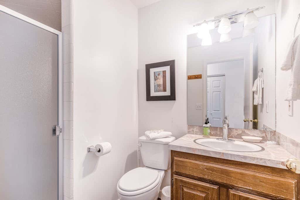Central townhouse with private hot tub, wood fireplace, & ski shuttle access