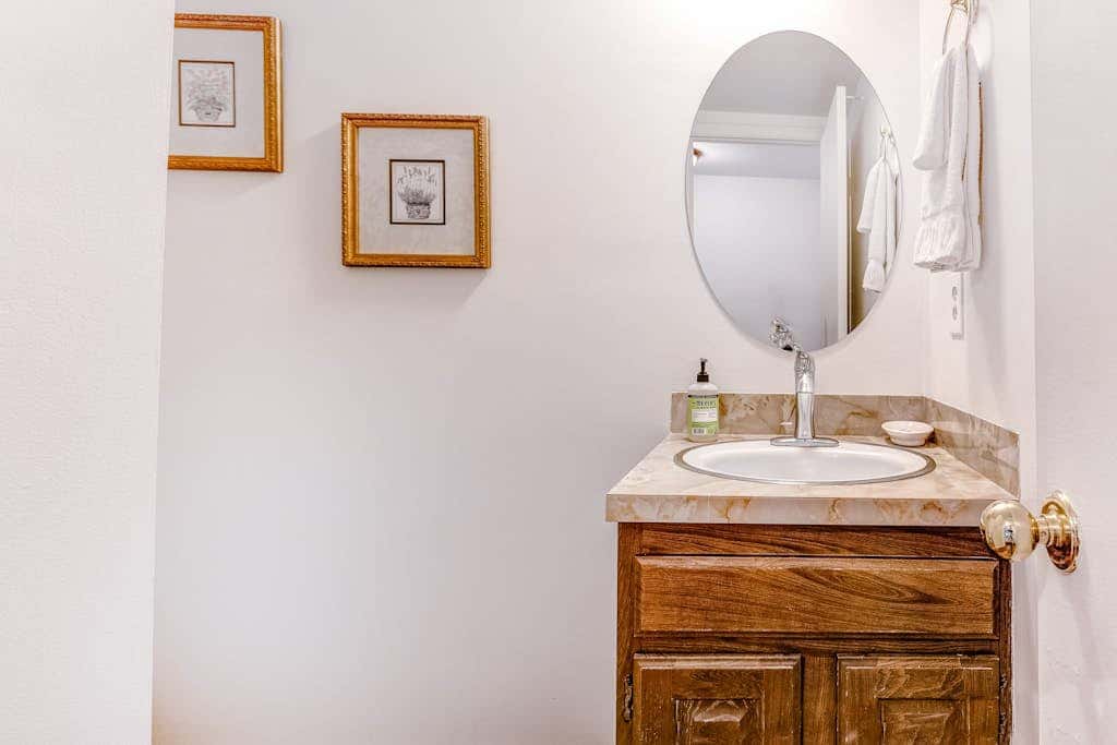 Central townhouse with private hot tub, wood fireplace, & ski shuttle access