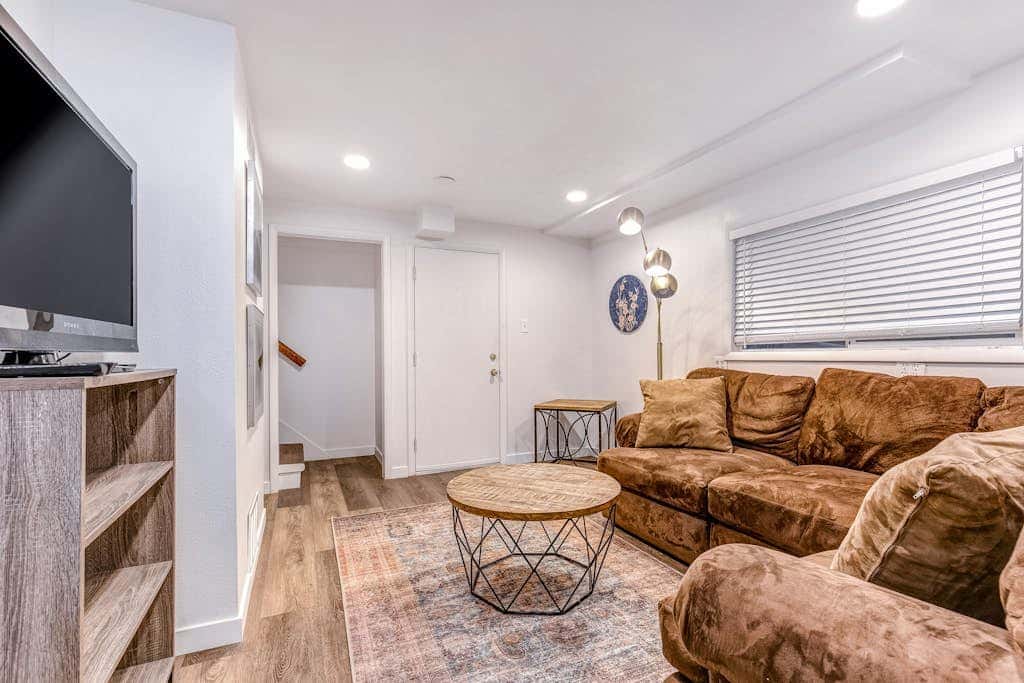 Central townhouse with private hot tub, wood fireplace, & ski shuttle access