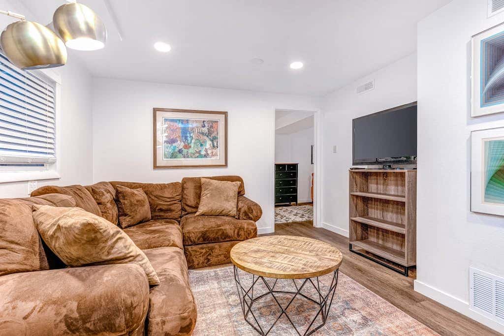 Central townhouse with private hot tub, wood fireplace, & ski shuttle access