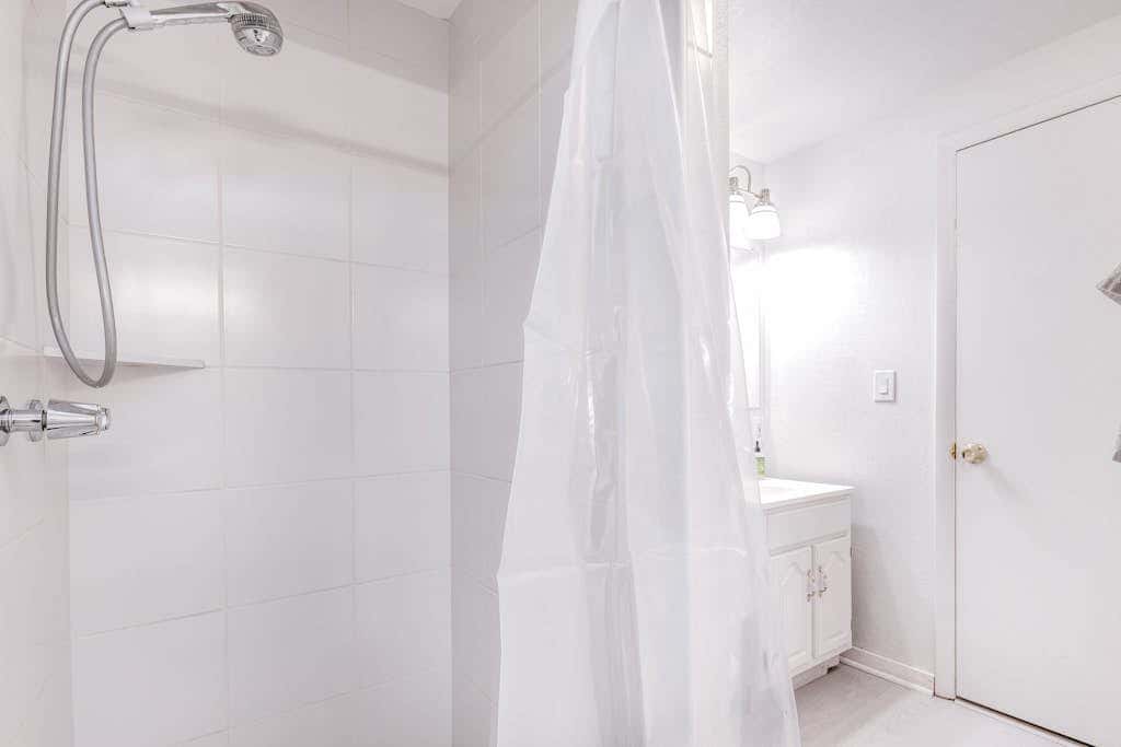 Central townhouse with private hot tub, wood fireplace, & ski shuttle access