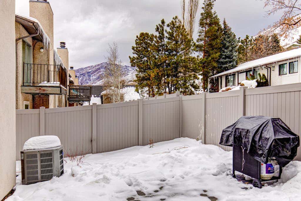 Central townhouse with private hot tub, wood fireplace, & ski shuttle access